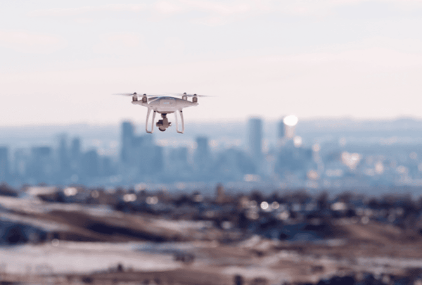 Unmanned aerial system approaching a distant city